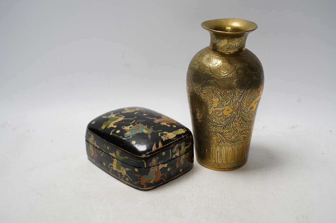 A Persian paper mache box and a brass vase with engraved decoration, largest 17cm high. Condition - vase fair, box restored